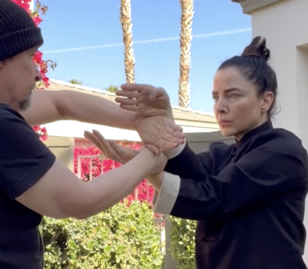 Kendra Mahon practicing Chi Sao sticky hands with a training partner